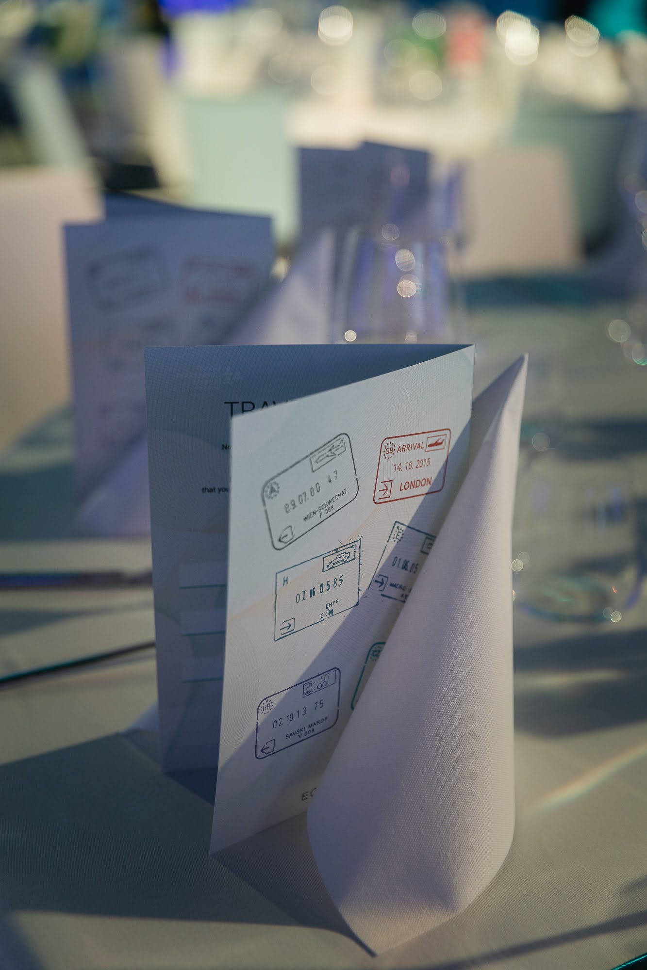 Travel passport place card on event table